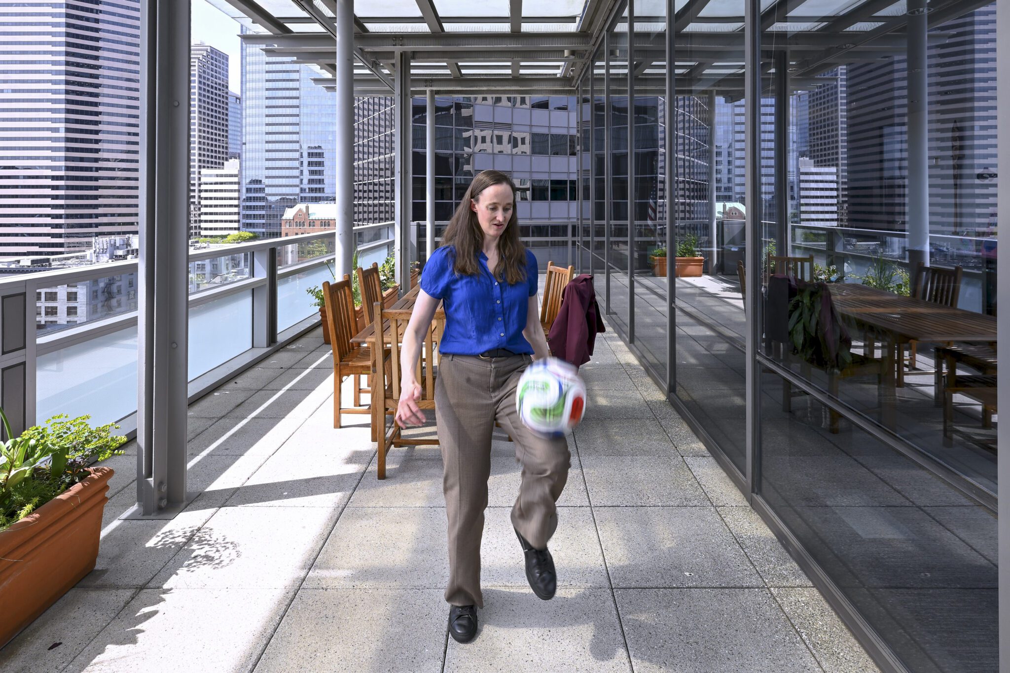 The mayor dribbling a soccer ball at City Hall