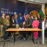 Mayor Wilson signing the do not solicit legislation