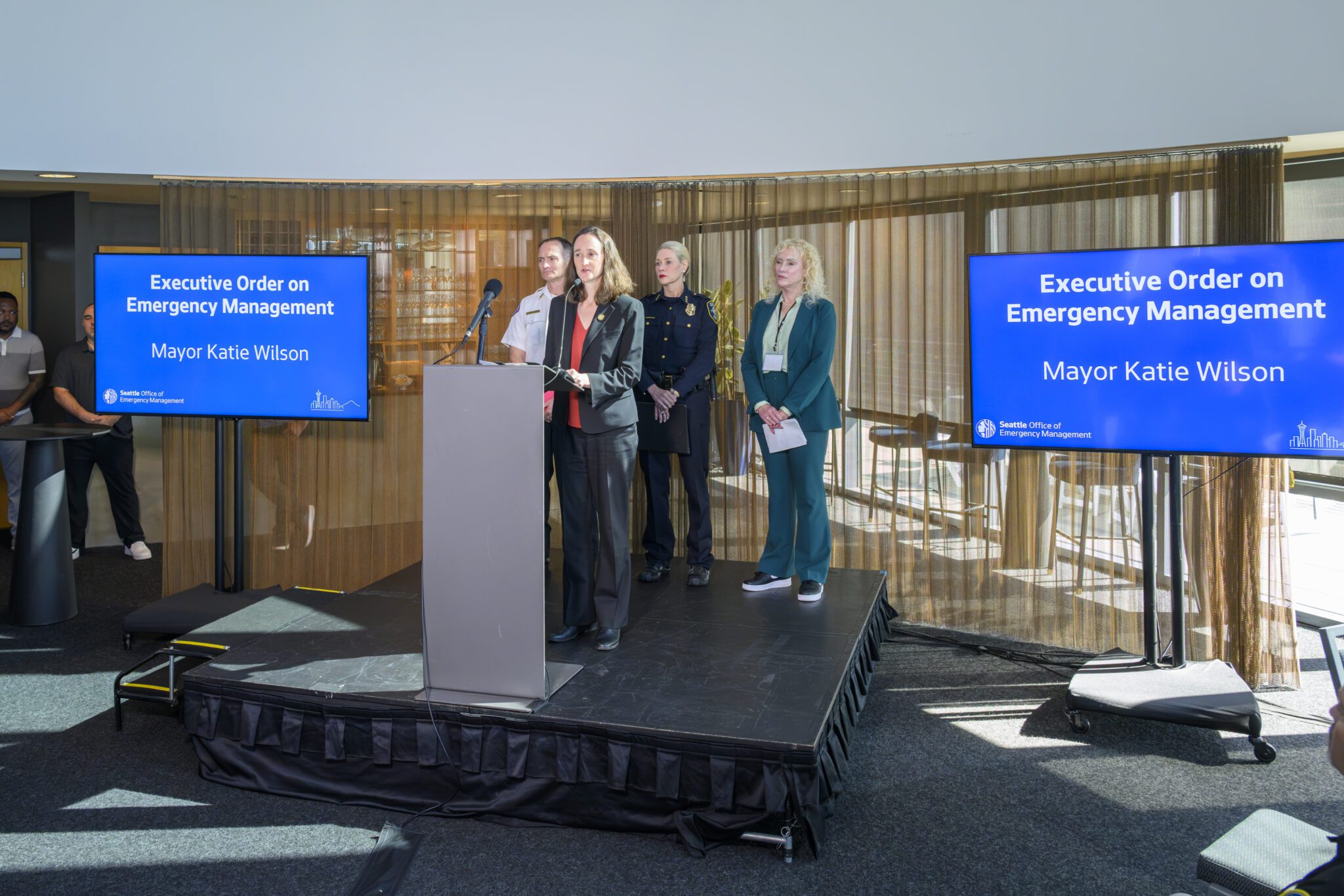 Mayor Wilson announcing her emergency management executive order with City leaders behind her